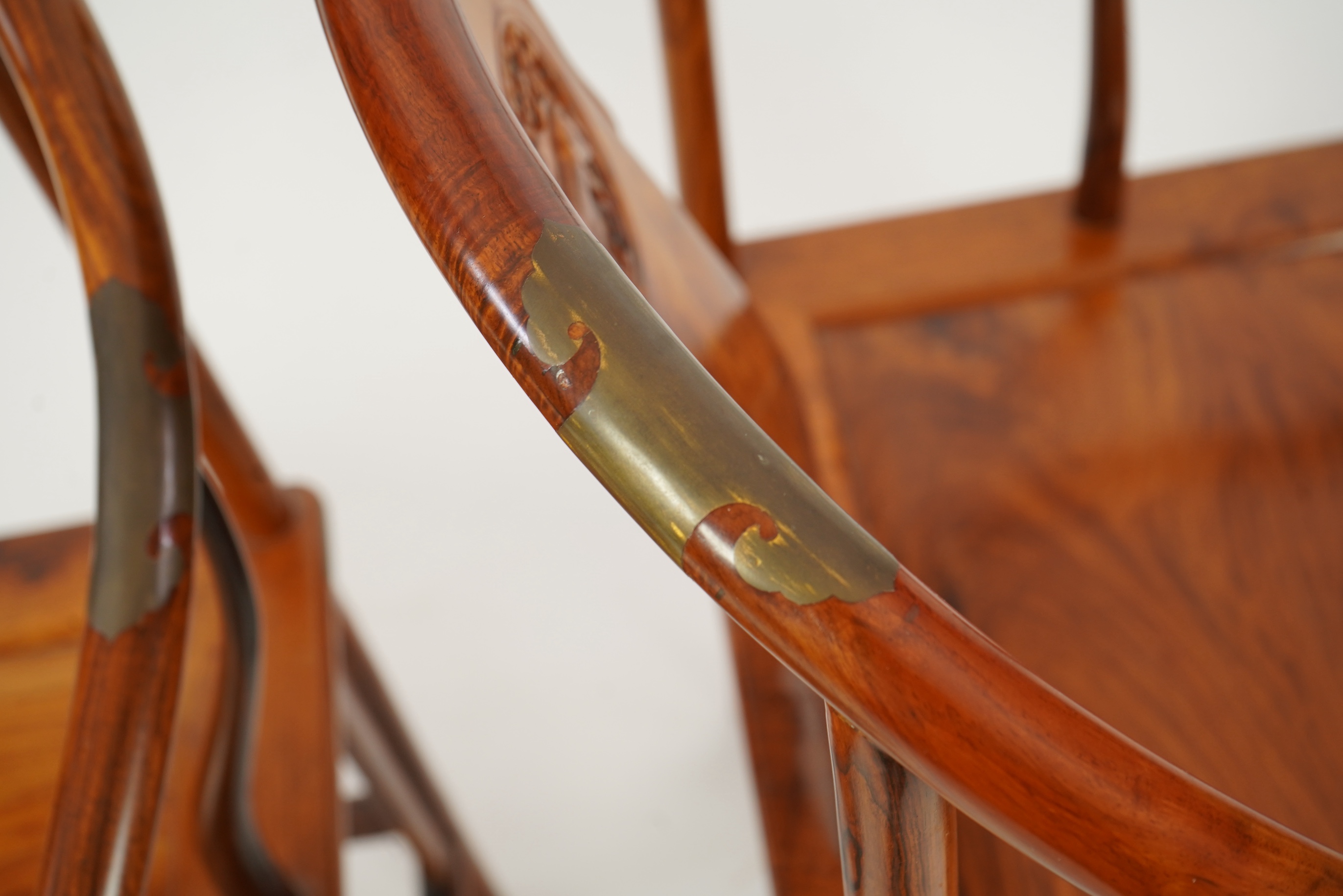 A pair of Chinese huanghuali and brass mounted horseshoe-back armchairs, quanyi, 19th century